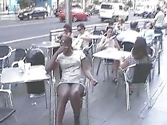 Artie in a cafe showing the guys whats up her skirt